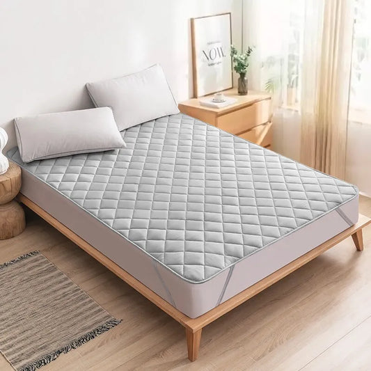 Duerma profundamente: Protector de colchón lavable por ultrasonidos con banda elástica